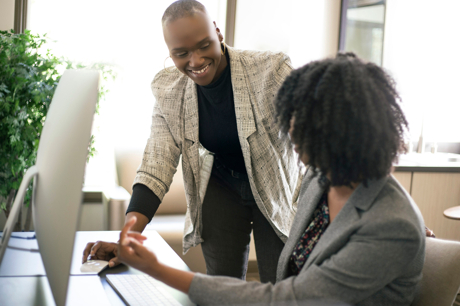 Black Female Office Coworkers Doing Teamwork